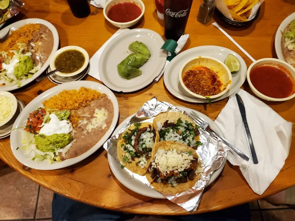 Two Beef Tacos Mexican Rice and Refried Beans